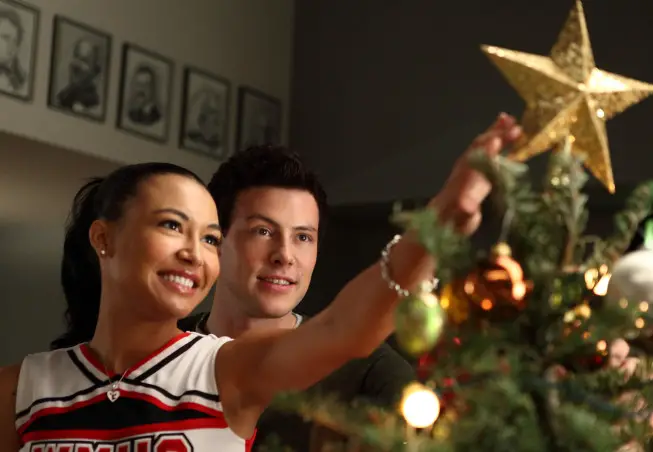 GLEE: Santana (Naya Rivera,  L) and Finn (Cory Monteith,  R) put the star on the Christmas tree in the "A Very Glee Christmas" episode of GLEE airing Tuesday,  Dec. 7 (8:00-9:00 PM ET/PT) on FOX. ©2010 Fox Broadcasting Co. CR: Justin Lubin/FOX