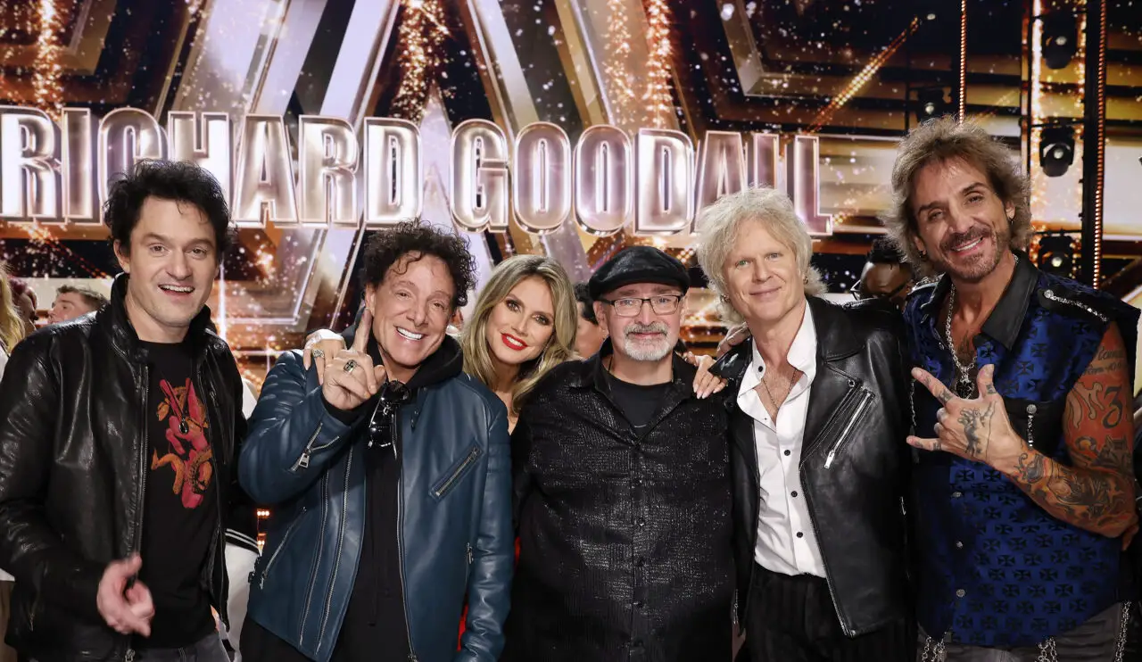 Members of Journey: Jason Derlatka, Neal Schon, Heidi Klum, Richard Goodall, Todd Jensen, Deen Castronova - America's Got Talent 2024 finale